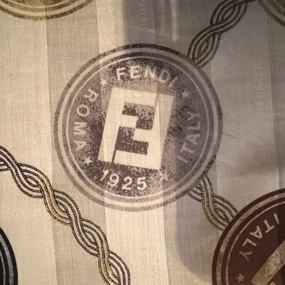 Fendi scarf 23 x 22.5” spend $400 get a free designer scarf valves at $400.
